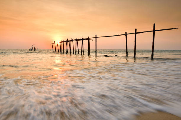 istock Wood bridge with seascape at sunset and motion wave 952697296