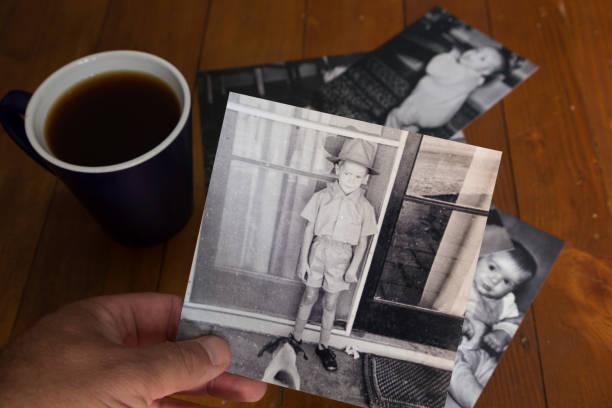 istock Looking at old photo's with nostalgia. 952697408