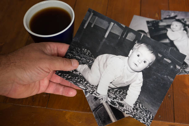 istock Looking at old photo's with nostalgia. 952699638