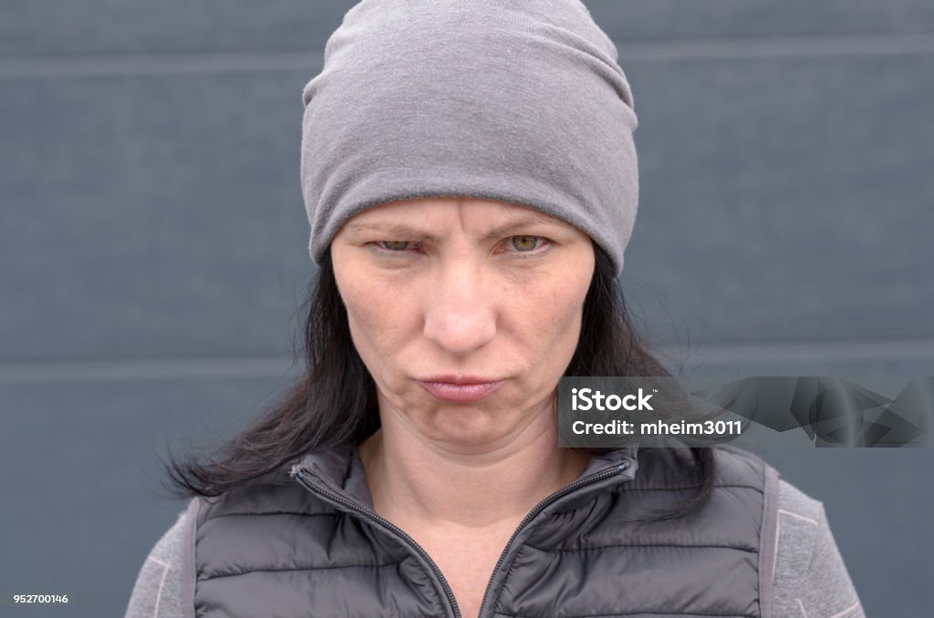 Woman Grumpy Face Woman Pulling Very Grumpy Face Stock Photo - Download Image Now ...