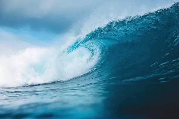 Photo of Ocean blue wave in ocean. Breaking wave for surfing in Bali