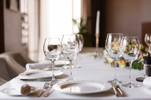 Luxury wedding reception. Flower arrangement on table in restaurant. Stylish decor and adorning