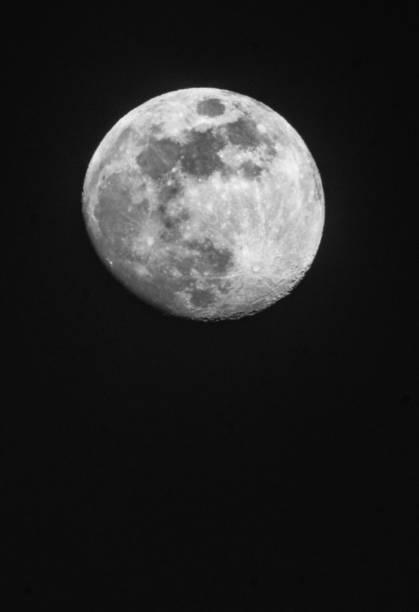 full moon up close in a black night sky full moon up close in a black night sky in April apollo 11 stock pictures, royalty-free photos & images