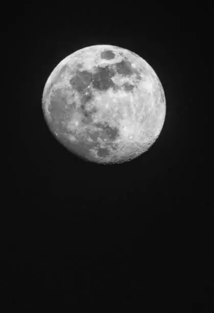 full moon up close in a black night sky in April