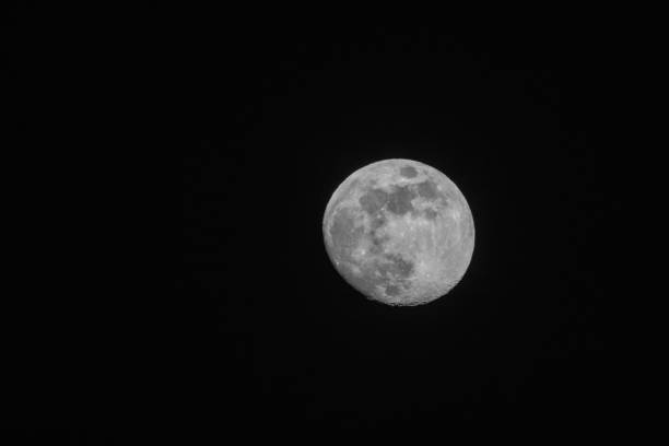 full moon up close in a black night sky in April