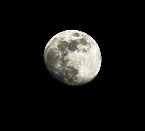 full moon up close in a black night sky in April