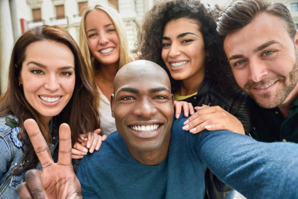 istock Multiracial group of young people taking selfie 952708620