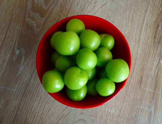 istock Green plums, sour fresh fruits 952715668