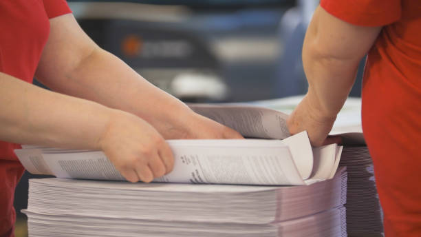 istock Hands of female workers laid the printed edition 952723674