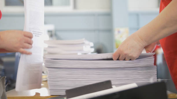 istock Hands of female workers laid the printed edition 952723722