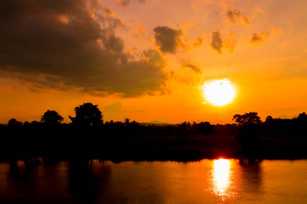 istock sunset beautiful colorful landscape and silhouette tree in sky twilight time 952726474