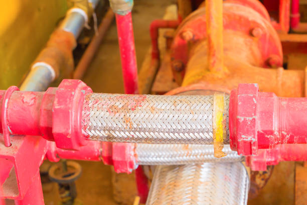 istock joint pipe system Old big plumbing  red which has dust dirty inside of building industrial 952729814