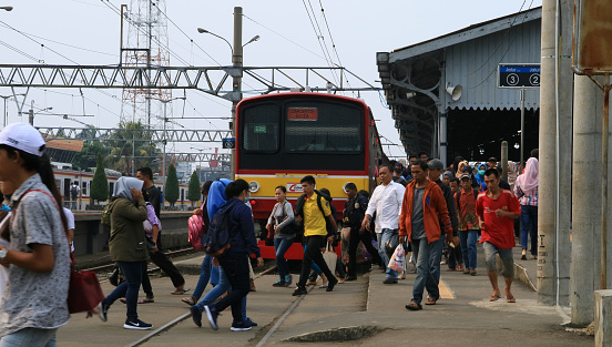 Bogor, Indonesia - April 14, 2018: Passengers of Commuter Line in Bogor Railway Station in West Java.