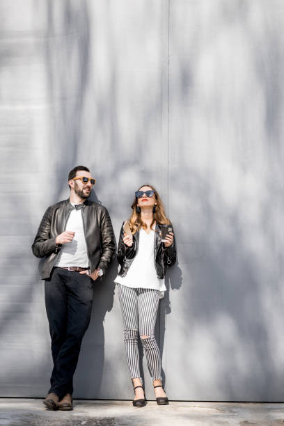 istock Stylish couple on the grey background 952730376