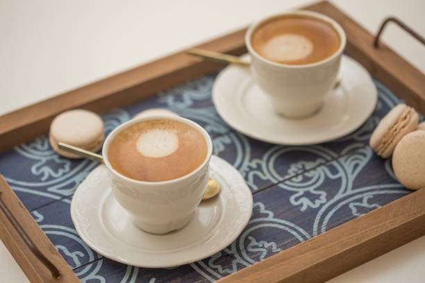 istock cups of coffee and macaroons 952730684