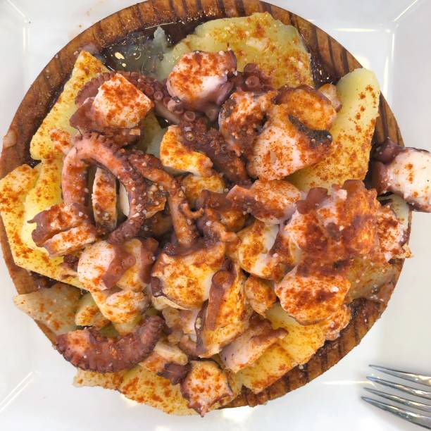 istock Spanish local meals - pulpo on potatoes 952730792