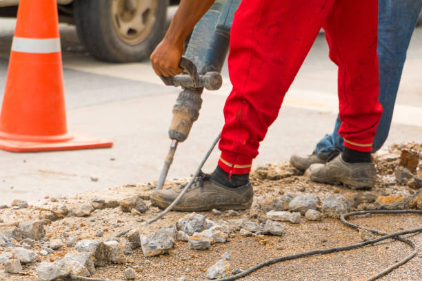 istock construction drilling repair worker on road surface with heavy duty machine drill motion 952738182