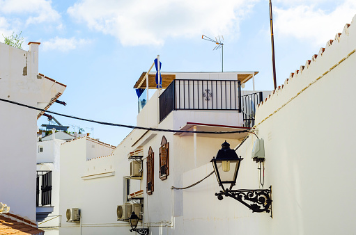 beautiful, picturesque street, narrow road, white facades of buildings, Spanish architecture, sunny day