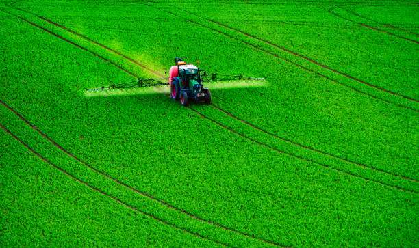 istock Farm machinery spraying insecticide 952744500