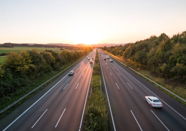 istock The road traffic on a motorway at sunset 952748230