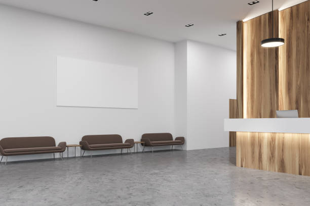 istock Wooden and white reception office, sofas, poster 952750752