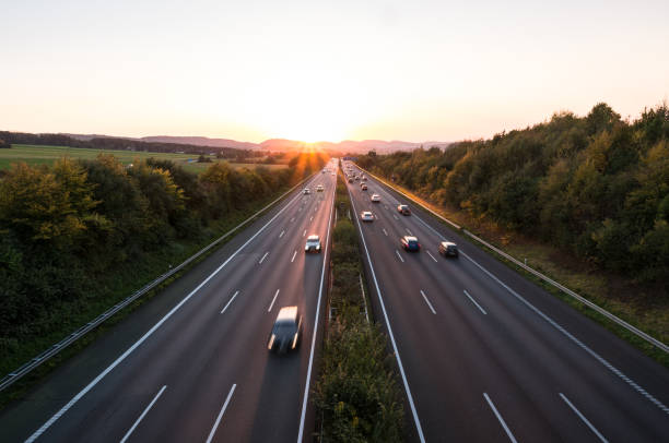 istock The road traffic on a motorway at sunset 952753338