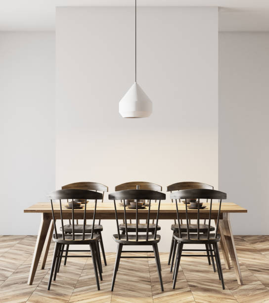 istock White dining room, black chairs, lamp 952754428