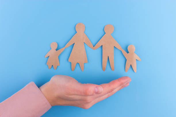 istock paper family on the earth planet 952754830