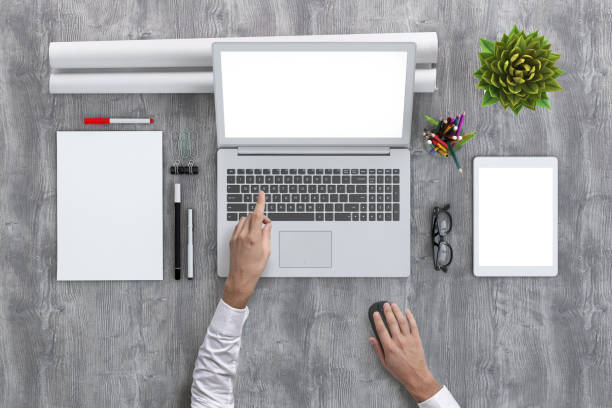 istock Man working on PC laptop knolling overhead view 952755058