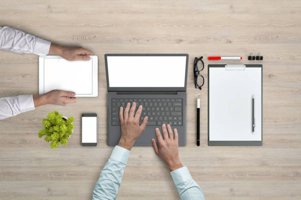 istock Business people working in office knolling overhead view 952755080