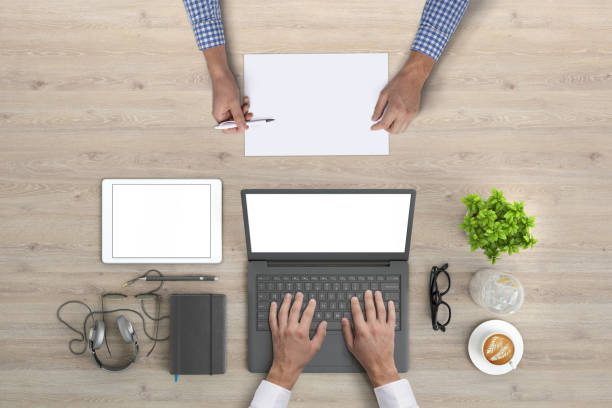 istock Business people working in office knolling overhead view 952755098
