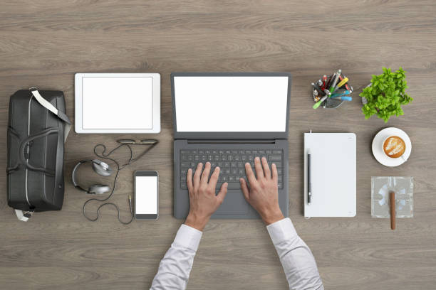 istock Man working on laptop knolling overhead view 952755134