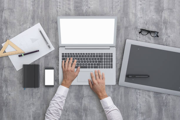 istock Architect designer working on office desk knolling overhead view 952755178