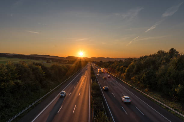 istock The road traffic on a motorway at sunset 952755514