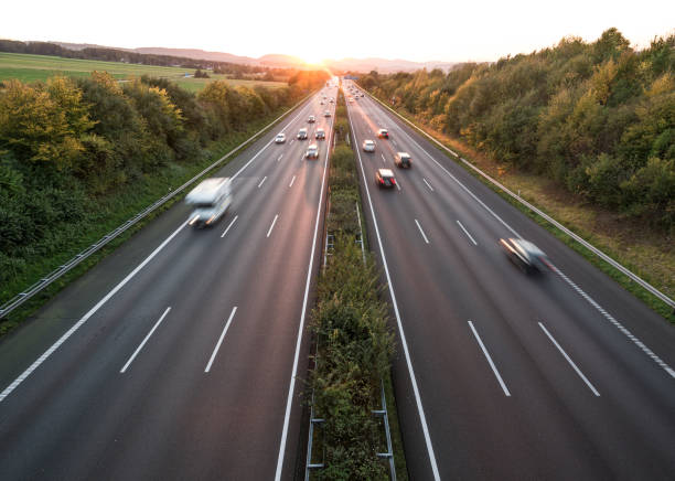 istock The road traffic on a motorway at sunset 952758490
