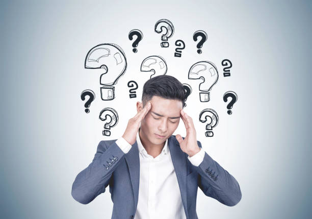 istock Stressed Asian businessman, questions 952759318