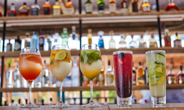 istock Refreshing Tropical Cocktails Drinks and fruit On Bar Counter Close-Up 952759582
