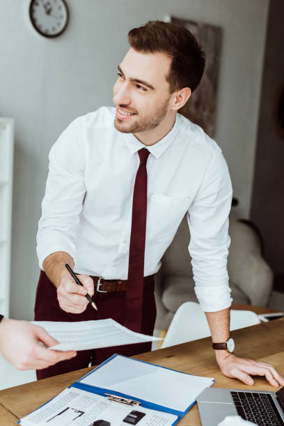 istock businessman working with documents and signing contract at workplace 952763524