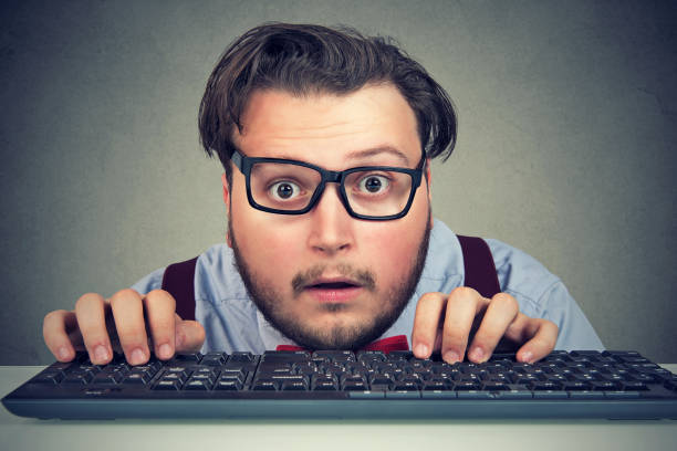 istock Surprised business man typing on key board 952767772
