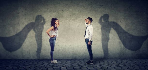 istock Brave man and woman posing as super hero 952769210