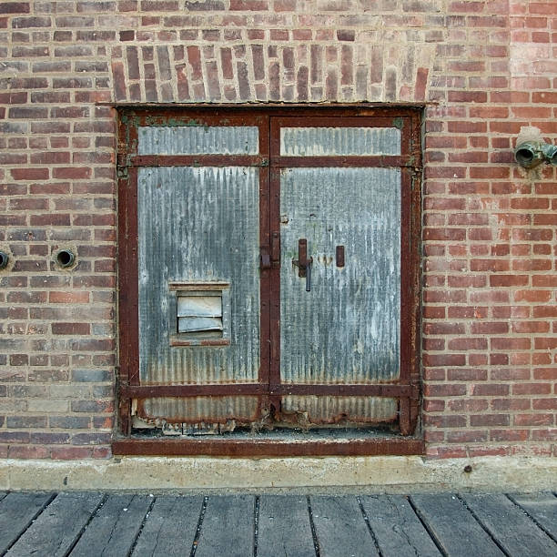 Mysterious door without handle inside brick wall
