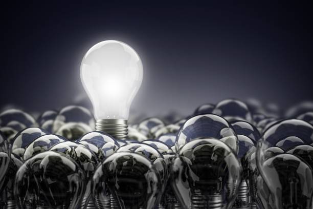 istock Illuminated light bulb standing Out in Crowd. Concept of idea and innovation,3d render 952776944