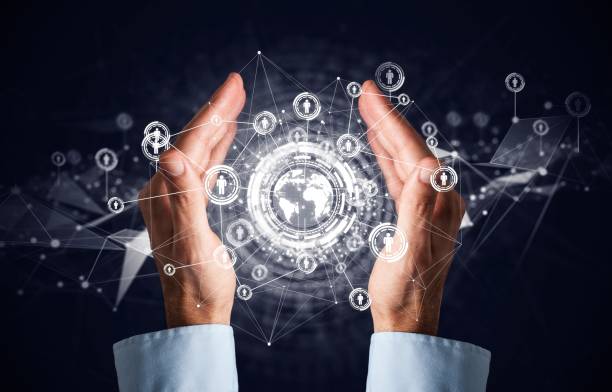 istock Businessman holding social media network icons structure 952777028