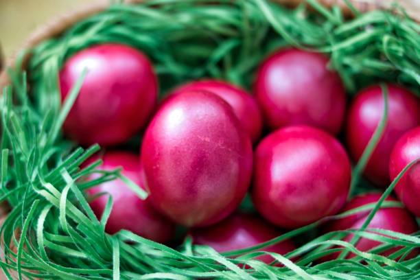 istock Painted in red eggs in a knot bowl - a nest.Selective focus. 952777752