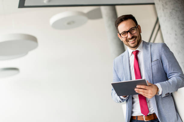 istock Young businessman with digital tablet in office 952777862