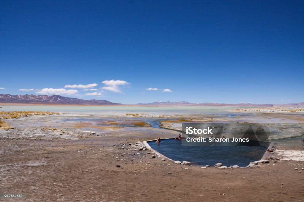 Tourists at the Polques hot springs in the Chalviri desert (on the Salar de Uyuni tour) Bolivia Tourists at the Polques hot springs. Chalviri desert (on the Salar de Uyuni tour) Bolivia Tupiza Stock Photo