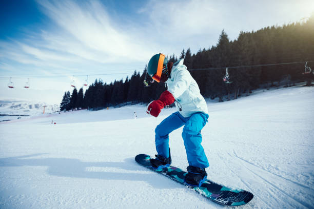istock One snowboarder descent on slope in winter mountains 952786594