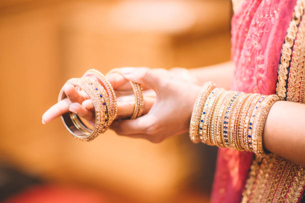 istock indian bride putting rings on her hand 952788378