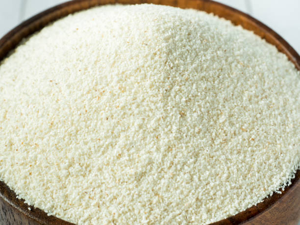 istock Semolina in a wooden bowl on a light background 952791280