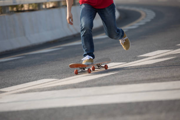 istock Skateboarder sakteboarding on city highway 952796224